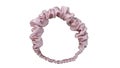 A headband with ruffle and ruched pattern made out of satin silk cloth fabric texture with white background
