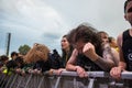 Headbanging crowd in the first row at a hardcore concert