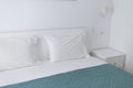 headboard, pillows in a white bed Royalty Free Stock Photo