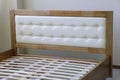 headboard with soft white leather upholstery Royalty Free Stock Photo