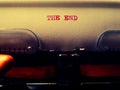 Heading `The End` written on a retro typewriter.