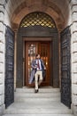 Heading home at the days end. A view of a businessman leaving work through an ornate doorway. Royalty Free Stock Photo