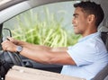 Heading off to make the next customer happy. a young delivery man driving a van. Royalty Free Stock Photo