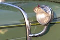 Headlamp and chrome detail on hood of vintage classic oldtimer car Royalty Free Stock Photo