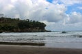 Headland on Serang Beach and cloudy sky Royalty Free Stock Photo