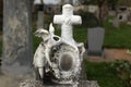 Headless angel. Destroyed tombstone at the abandoned cemetery.