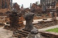Headless human statue between ruins of buddhist temple