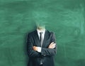 Headless man on chalkboard background Royalty Free Stock Photo