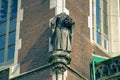 Headless sculpture on the corner of the building