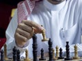 An Arab man playing chess at his desk 5 Royalty Free Stock Photo