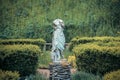 Headless statue of with a sheep in the garden Royalty Free Stock Photo