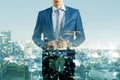 Headless young businessman silhouette in suit standing on creative night city background. Future, success and career concept. Royalty Free Stock Photo