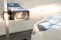 Headlight adjustment in a car by an authorized service Royalty Free Stock Photo