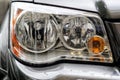 Headlight closeup of grey sporty car Royalty Free Stock Photo