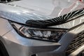 Headlight of grey modern car with LED light Royalty Free Stock Photo