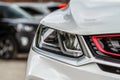 Headlight lamp of new car. Close up detail on one of the LED headlights modern car. Royalty Free Stock Photo