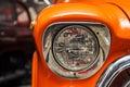 Headlight lamp vintage car. Classic car headlight. Close-up of headlights of orange vintage car. Exhibition Royalty Free Stock Photo