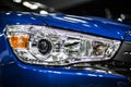 Headlight of modern blue car with led and xenon optics Royalty Free Stock Photo