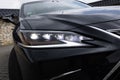 Headlight of modern luxury car. Close up detail shot super bright and modern LED matrix headlight lamps. Front matrix