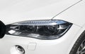 Headlight of a modern sport car. The front lights of the car. Modern Car exterior details. Royalty Free Stock Photo