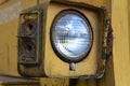 Headlight of an old abandoned broken road construction machine Royalty Free Stock Photo