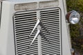 Headlight of an old Citroen H-type corrugated iron panel van