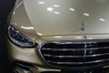 Headlight and part of the front mask of full sized german luxury sedan Mercedes S400 D 4-Matic