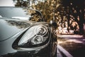 Headlight of a Porsche sports car.