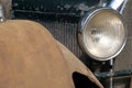 Headlight and radiator  of old  retro vintge rusty car ckose-up Royalty Free Stock Photo