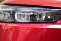 close up headlight of red car, transportation industry Royalty Free Stock Photo