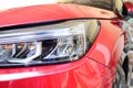 close up headlight of red car, transportation industry Royalty Free Stock Photo