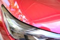 close up headlight of red car, transportation industry Royalty Free Stock Photo