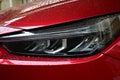 close up headlight of red car, transportation industry Royalty Free Stock Photo