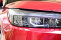 close up headlight of red car, transportation industry Royalty Free Stock Photo