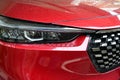 close up headlight of red car, transportation industry Royalty Free Stock Photo