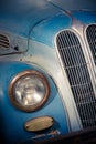 Headlight of a vintage blue classic car Royalty Free Stock Photo