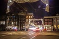 Headlights car passing down street at night Royalty Free Stock Photo