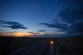 Two coal trains roll through Wyoming at sunset Royalty Free Stock Photo