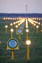 Headlights of runway lights at the airport on the background of the evening sky Royalty Free Stock Photo