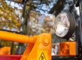 Headlights and turn signals on agricultural machinery. Hazard warning lights, industry, copy space for text Royalty Free Stock Photo