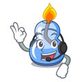 With headphone alcohol burner mascot cartoon Royalty Free Stock Photo