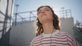 Headphone girl relaxing sunlight moving in tact song outdoors close up.