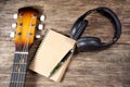 Headphone guitar notebook pencil Royalty Free Stock Photo