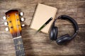 Headphone guitar notebook pencil Royalty Free Stock Photo