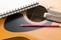 Headphone guitar notebook and pencil Royalty Free Stock Photo