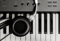 Headphone on key piano background. Royalty Free Stock Photo