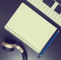 Headphone Keyboard and for blank book for music writing. Song writing equipment in vintage tone.