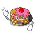 With headphone pancake with strawberry mascot cartoon