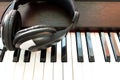 Headphone and piano. Royalty Free Stock Photo
