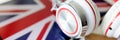 Headphones on the background of the flag of Great Britain Royalty Free Stock Photo